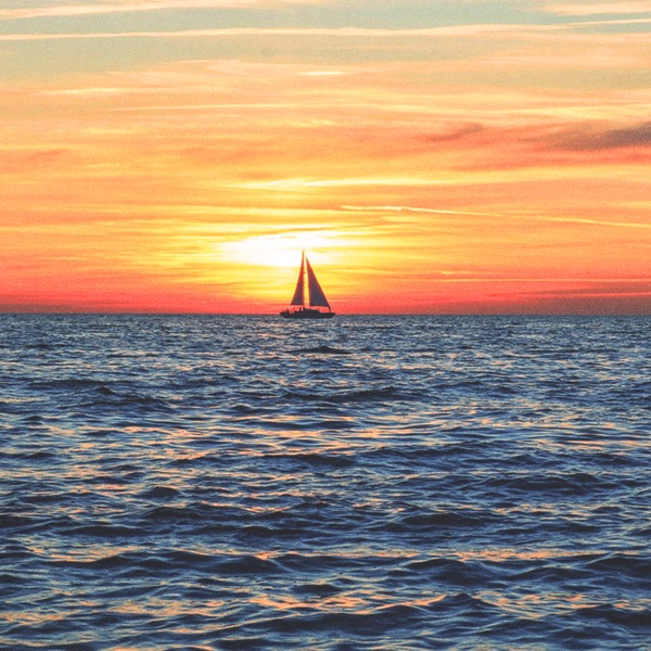Sam Burnham’s avatar: a sailboat silhouetted against an orange sunset